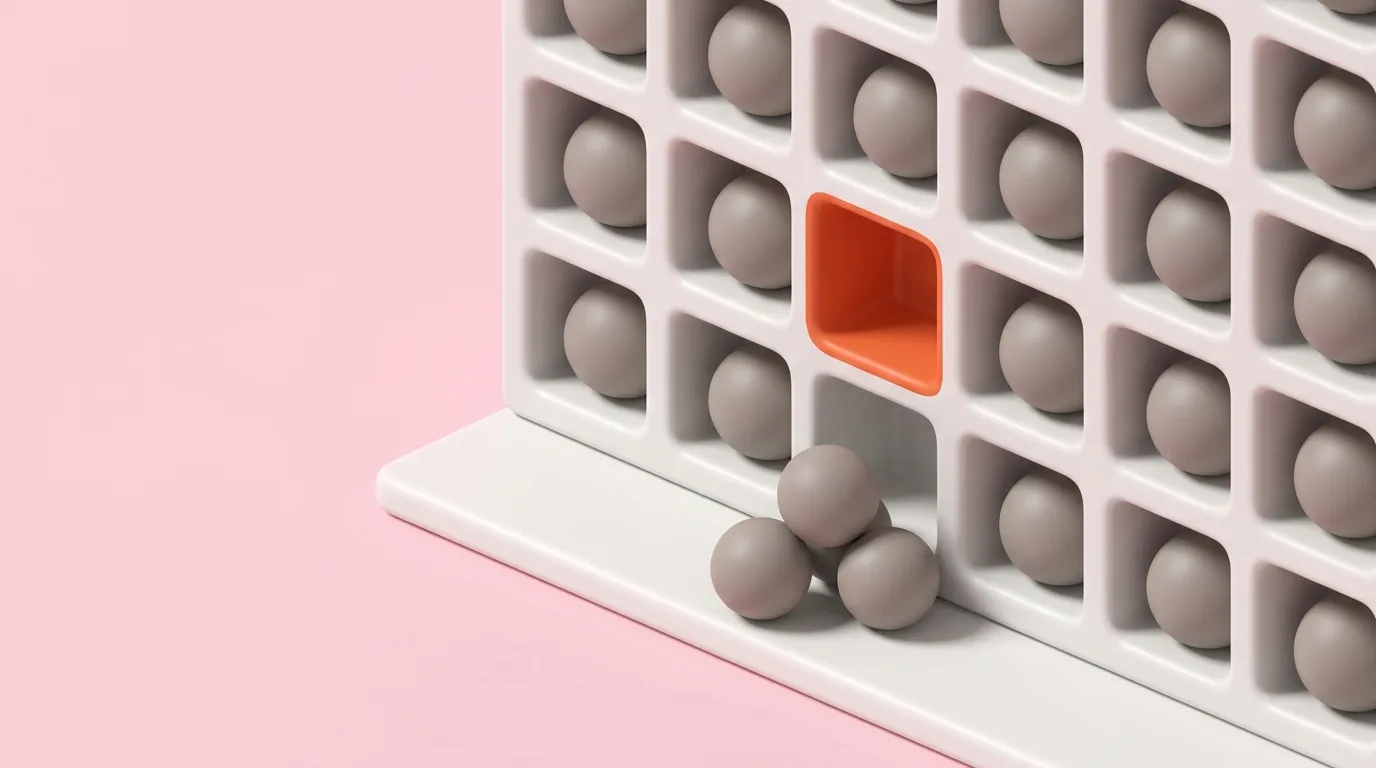 A white wall of square pigeonhole slots with a grey sphere seated in each one, except a single empty orange slot with three spheres fallen out beneath it onto a ledge
